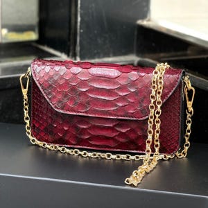 First-class, entirely handcrafted genuine python leather shoulder bag with strap, suitable for everyday use.