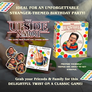 May include: A board game box titled 'The Upside Down' with a colourful design. The game includes a game board and a spinner. The box features a picture of a person with glasses. The game is for 2+ players.