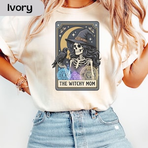 Skeleton witch with raven, moon, stars, and text "The Witchy Mom."