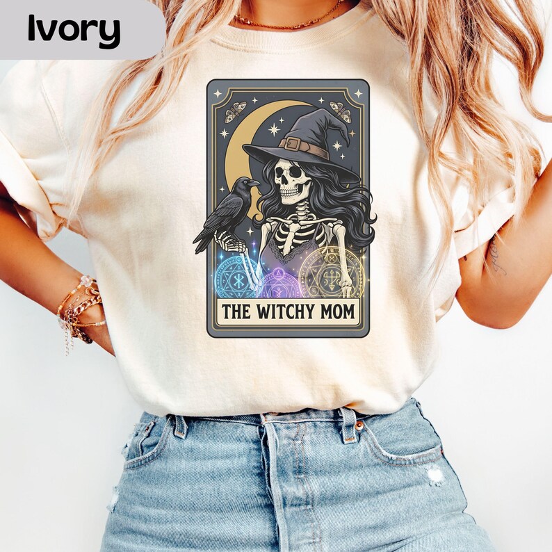 Skeleton witch with raven, moon, stars, and text "The Witchy Mom."