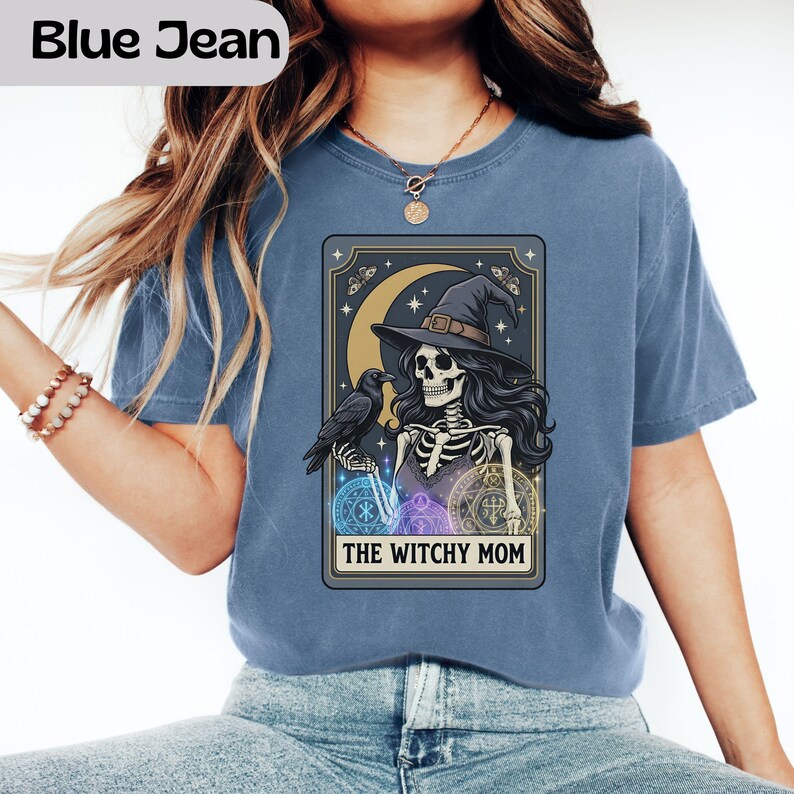 Skeleton in witch hat with crow and moon, "The Witchy Mom" text.