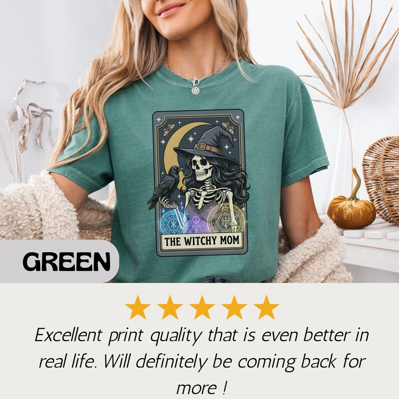 Green t-shirt with "The Witchy Mom" skeleton and raven graphic.