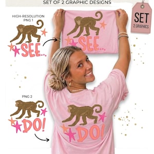 May include: Pink t-shirt with a brown monkey graphic, pink stars, and the text "SEE..." on the front. The back of the shirt features the same monkey graphic, pink stars, and the text "DO!". The image also shows a tag that says "SET 2 GRAPHICS".
