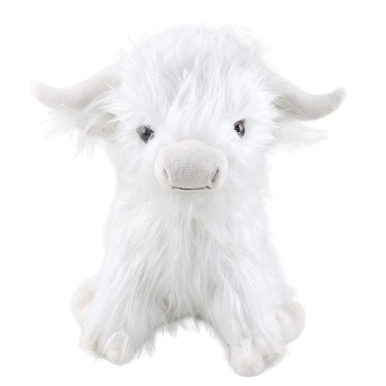 May include: A plush white Highland cow toy with a fluffy, shaggy coat. The stuffed animal has small, curved horns, a soft snout, and dark eyes. The toy is sitting upright, with its legs extended.