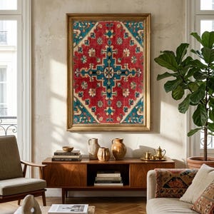 May include: A framed, rectangular rug with a red background and a central teal and cream geometric design. The rug is displayed above a wooden cabinet with decorative vases and books. A neutral-toned sofa and armchair complete the living room setting.