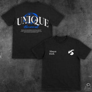 May include: Two black t-shirts. One displays the word "UNIQUE" in white, arched over "Abnormal" in blue, with a blue and black graphic. The other shirt has "Abnor mal." and a white graphic. Both have short sleeves.
