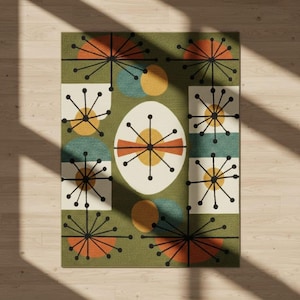 May include: A rectangular olive green rug with a mid-century modern design. The rug features geometric shapes in orange, yellow, teal, and white. The design includes starbursts, circles, and an egg-shaped central motif.