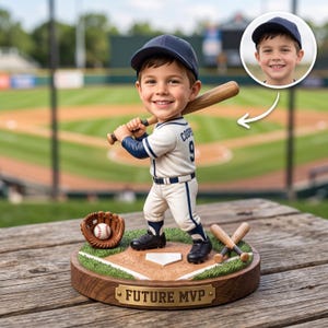 May include: A custom bobblehead figurine of a young baseball player wearing a navy blue cap and a white uniform with the name Cooper and number 9 on the back. The figure holds a wooden bat, stands on a base with a baseball field design, and features a plaque reading FUTURE MVP.