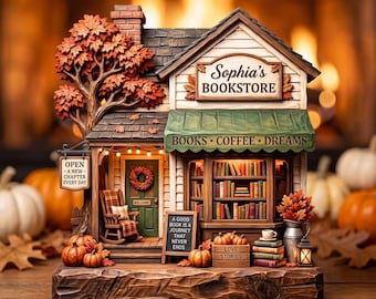 Puede incluir: Una figura de librería en miniatura titulada Sophia's Bookstore con un toldo verde que dice BOOKS COFFEE DREAMS, un porche con una mecedora, una corona en la puerta, estanterías de libros, calabazas y un letrero con texto.