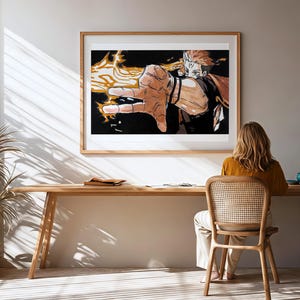 Pode incluir: Uma impress&atilde;o art&iacute;stica emoldurada com uma ilustra&ccedil;&atilde;o detalhada de um personagem com energia flamejante emanando de sua m&atilde;o. A obra de arte &eacute; definida contra um fundo preto e emoldurada em madeira clara. A cena &eacute; em uma sala com uma mesa e cadeira de madeira.