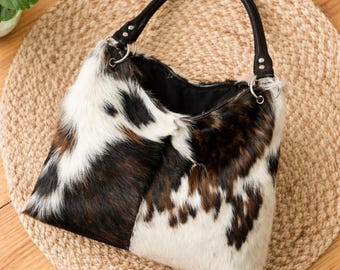 Hobotas rundleder: hair on leren draagtas, westerse stijl