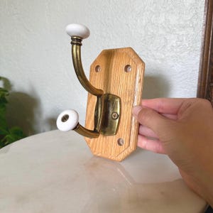 Vintage Brass and Oak Wall Hook with Ceramic Knobs