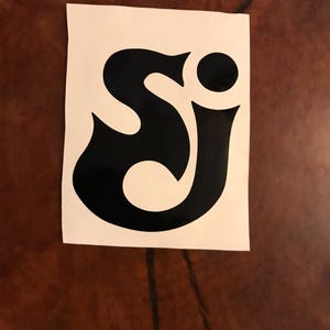 May include: Black vinyl decal of the letters "SJ" in a stylized font.
