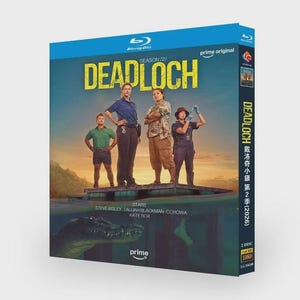 May include: A Blu-ray disc case for "Deadloch" Season 2. The cover features a teal background with the show's title in yellow and a group of four people standing on a platform. The Prime Video logo is visible.