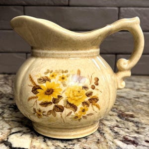 1974 McCoy Art Pottery Speckled Beige Tan 5" Pitcher with Flowers #7528