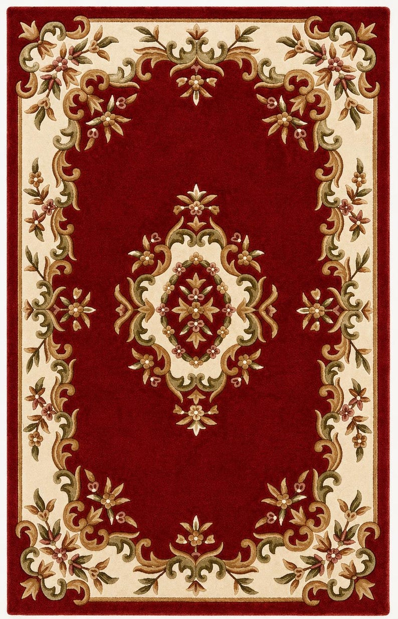 May include: A rectangular area rug featuring a deep red center field with a central cream-colored floral medallion. The border consists of a cream-colored frame decorated with scrolling green and brown vine motifs and small floral accents.