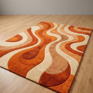 May include: A rectangular rug with a retro design. The rug features a wavy pattern in shades of orange, cream, and brown. The rug is placed on a wooden floor, creating a warm and inviting atmosphere.