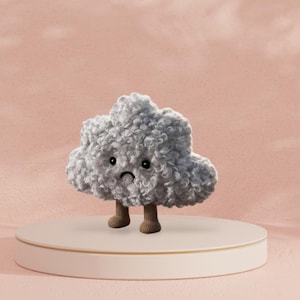May include: A grey, plush cloud character with a sad face, standing on a white and gold platform. The cloud has small, dark eyes and brown, stubby legs. The background is a soft, pink colour.