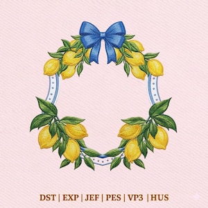 May include: Embroidered lemon wreath with a blue bow at the top. The wreath features yellow lemons and green leaves, set against a pink background. The frame has a blue and white striped design.
