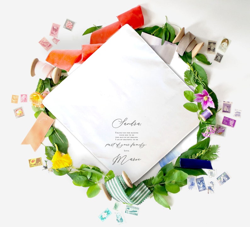 mother in law handkerchief laying open inside a colorful ring of ribbon and flowers