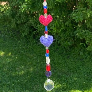 Sparkly Suncatcher with Red and Blue Hand-Knit Hearts and Crystal Prism