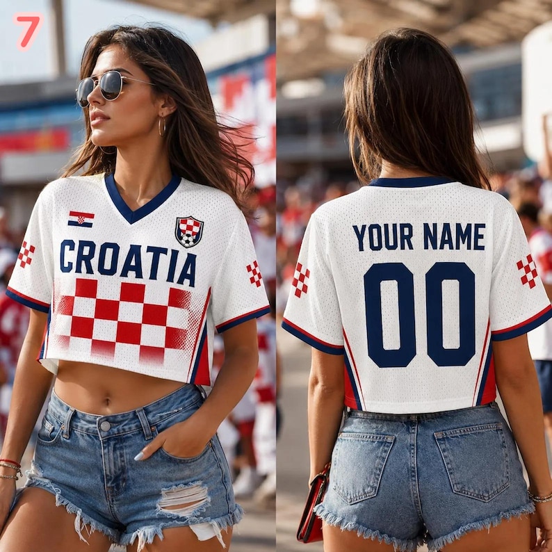 May include: A white cropped V-neck jersey featuring the text CROATIA and a red and white checkered pattern on the front. The back displays the text YOUR NAME and the number 00 in dark blue. The jersey has short sleeves with red and blue trim.