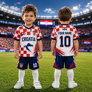 May include: A soccer uniform featuring a red and white checkered pattern on the jersey, with the text CROATIA and a map graphic on the front. The back displays the text YOUR NAME and the number 10. The set includes dark blue shorts with the number 10.