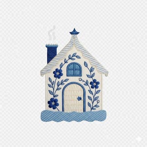 May include: Embroidered cottage with a blue and white color scheme. The house features a blue chimney with smoke, a blue roof, and blue floral accents. The door and window are also blue. The base of the house is a wavy blue design.