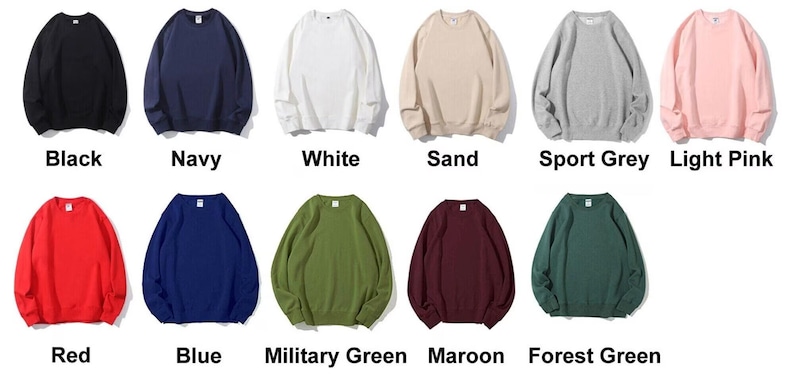 May include: A collection of crewneck sweatshirts in various colors, including black, navy, white, sand, sport grey, light pink, red, blue, military green, maroon, and forest green. Each sweatshirt is displayed with its color name.