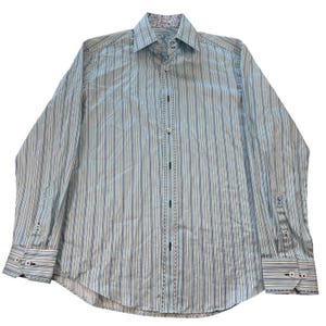 May include: A long-sleeved button-down shirt with vertical stripes in shades of blue, white, and brown. The shirt features a patterned collar lining and cuff details. The cuffs have button closures.