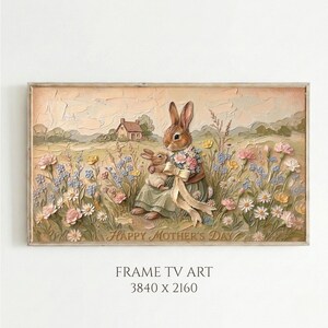 May include: A framed artwork featuring a mother rabbit and a baby rabbit in a field of flowers. The mother rabbit holds a bouquet and wears a dress. The artwork has a textured appearance and includes the text "HAPPY MOTHER'S DAY".