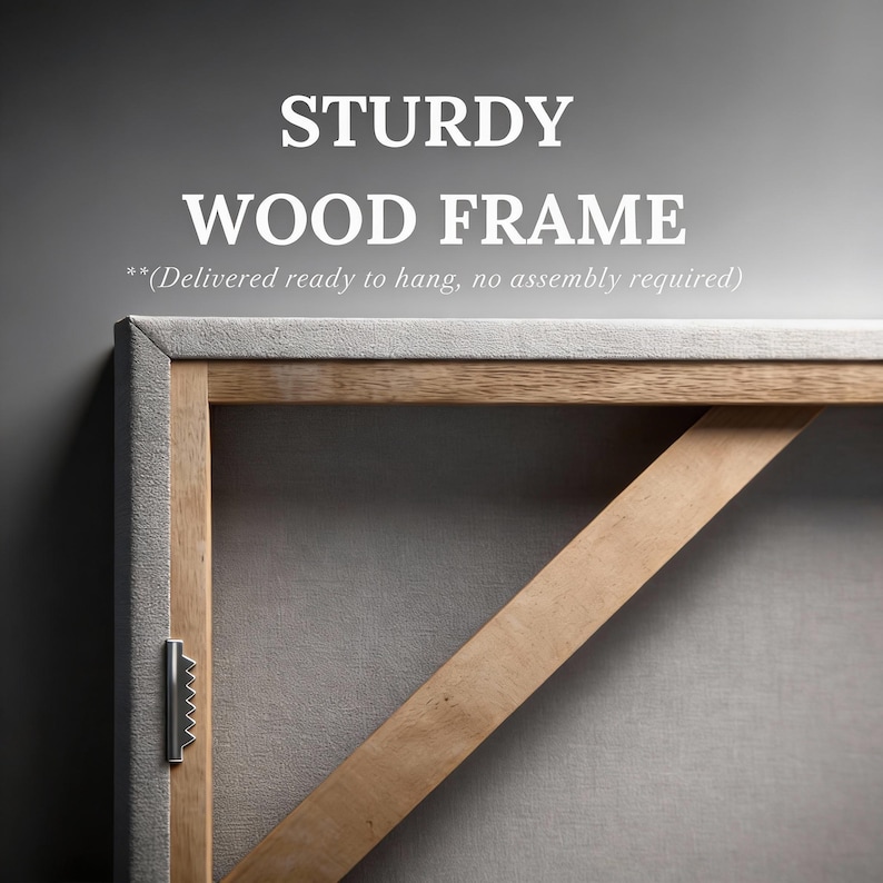 May include: A light-colored wooden frame with a diagonal support brace and a metal sawtooth hanger attached to the side. The text STURDY WOOD FRAME and (Delivered ready to hang, no assembly required) are printed above the frame structure.