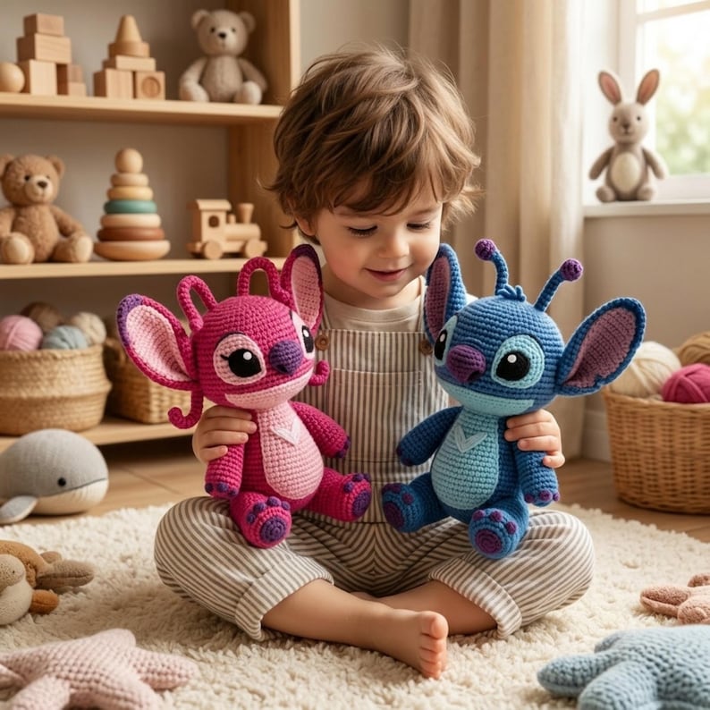 May include: Two handmade crochet plush toys featuring large ears and antennae. One toy is vibrant pink with a light pink belly, while the other is bright blue with a light blue belly. Both have large dark eyes and a small nose, crafted in a soft yarn.