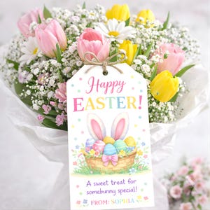 May include: A bouquet of pink tulips, yellow tulips, white daisies, and baby's breath, with a decorative tag that reads "Happy Easter!" The tag features a basket of Easter eggs and bunny ears. The tag is tied to the bouquet with twine.