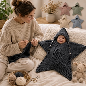 May include: A dark gray star-shaped crochet baby swaddle blanket with a hood and silver buttons. The swaddle features a textured knit pattern and is shown alongside four smaller color variations in pink, green, beige, and blue.