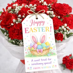 May include: A bouquet of red roses and carnations with a decorative tag. The tag reads "Happy Easter!" with a bunny and Easter eggs illustration. The tag also says "A sweet treat for somebunny special!" and "FROM: SOPHIA".