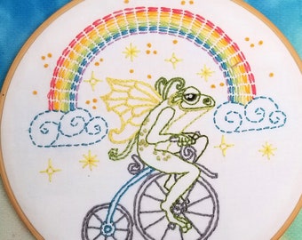 Printed fabric embroidery pattern. Frog Fairy, rainbow, bicycle design on 100% cotton embroidery fabric. 10.5 " x 10.5" stitching sampler.