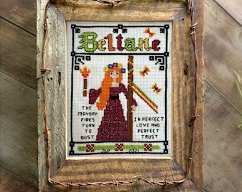 Beltane cross stitch pattern sabbat for May Day. Features a primitive Celtic-style goddess, maypole and Beltane chant. PDF Download