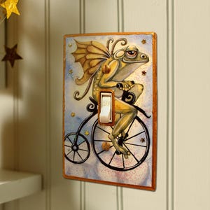 Light Switch Cover Unique Handmade Frog Fairy Switch Plate | riding antique bicycle in the clouds with gold stars and glitter Elfin Forest
