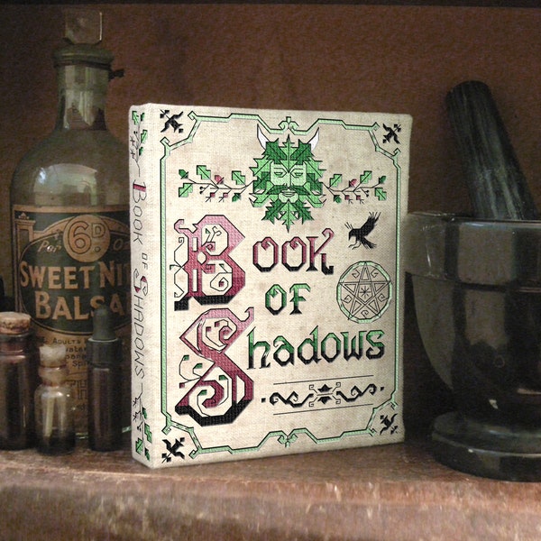 Pagan cross stitch patterns and Wiccan Book of Shadows book binding DIY tutorial with Green Man and Celtic knot work by The Elfin Forest