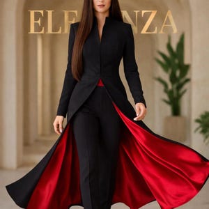 May include: A black suit with a long, open jacket revealing a vibrant red lining. The suit includes matching black pants. The word "ELEGANZA" is visible in gold lettering in the background. The outfit is a stylish ensemble.