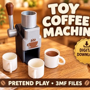 May include: A toy coffee machine with a silver and black body, a brown handle, and a brown coffee cup icon on the front. The set includes three small white mugs, one filled with brown liquid. Text reads TOY COFFEE MACHINE and PRETEND PLAY 3MF FILES.