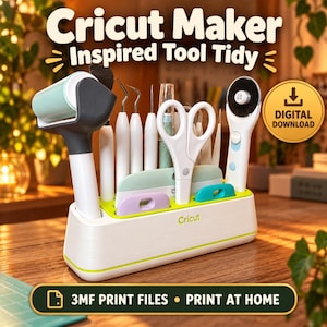 May include: A white and lime green plastic tool organizer for craft supplies with the text Cricut Maker Inspired Tool Tidy. The organizer holds various tools including a lint roller, scissors, and a rotary cutter. Includes a digital download icon.