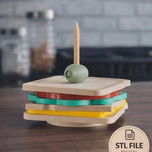 Può includere: Un set di sottobicchieri in legno a forma di sandwich, con strati rossi, verdi e gialli. Include uno stuzzicadenti in legno e un porta olive verde. Il testo "Coaster Set" è in alto.