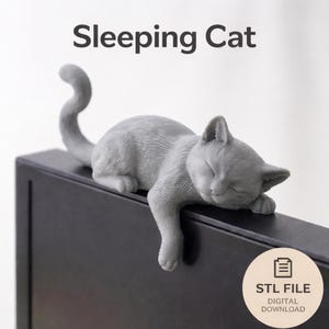 May include: A gray, sleeping cat figurine with its paws and head resting on a black surface. The cat's tail curves upwards. The text "Sleeping Cat" is above the cat. The image also includes the text "STL FILE DIGITAL DOWNLOAD".