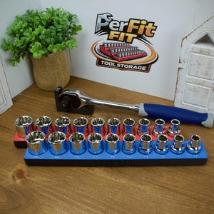 May include: A set of chrome sockets in a blue and red holder, with a blue and grey handled ratchet wrench. The image includes a logo that says "PerFit FIT Tool Storage". The background includes a small plant and decorative wooden cutouts.