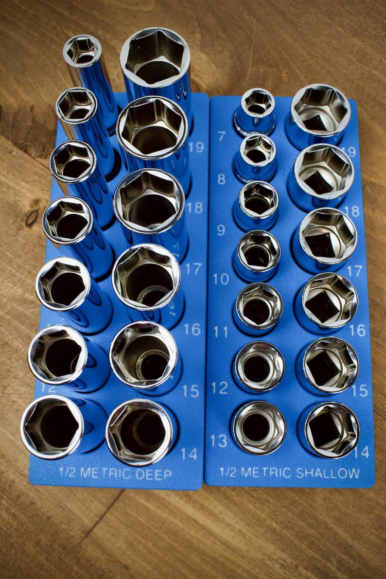 May include: A set of chrome sockets in a blue organizer. The sockets are arranged by size, with the sizes ranging from 7 to 19. The organizer is labeled "1/2 METRIC DEEP" and "1/2 METRIC SHALLOW".