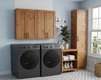 May include: A laundry room featuring a pair of black washing machines, wooden cabinets, and a tall wooden storage cabinet. A small wooden shelf holds towels and cleaning supplies. The room has a light blue wall and a patterned floor.