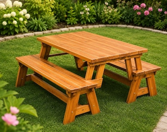 May include: A wooden picnic table with two attached benches featuring a rectangular tabletop and A-frame legs. The furniture is constructed from light brown wood planks with a visible grain, designed for outdoor seating in a garden setting.