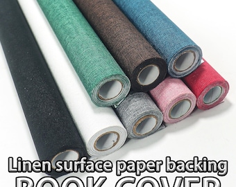 May include: Assortment of rolled linen surface paper backing book covers in various colors, including black, white, green, brown, blue, pink, gray, and red. The text "Linen surface paper backing BOOK COVER" is displayed at the bottom.